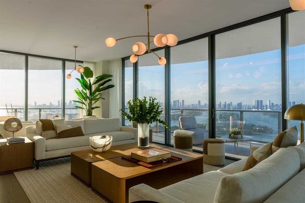 500 Alton Road, Unit 3903 04 Miami Beach, FL 33139 - Photo 4 of 72 a living room with furniture and a floor to ceiling window
