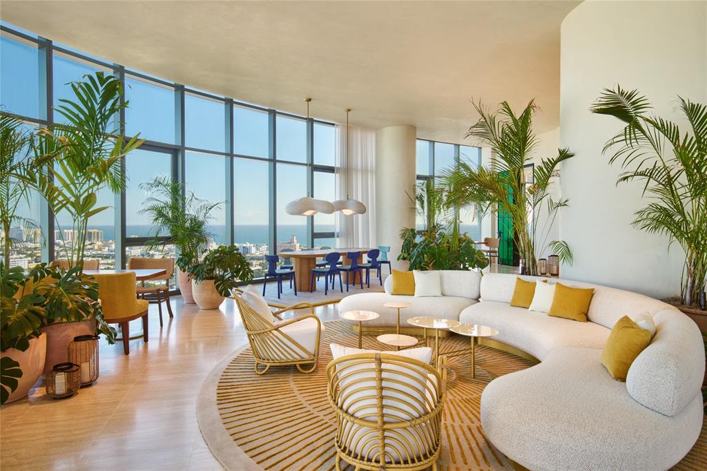 500 Alton Road, Unit 3903 04 Miami Beach, FL 33139 - Photo 44 of 72 a living room with furniture potted plant and a large window