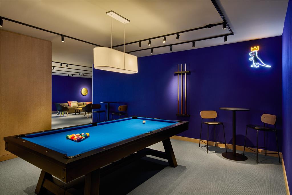 500 Alton Road, Unit 3903 04 Miami Beach, FL 33139 - Photo 63 of 72 a room with pool table gym equipment and a chandelier