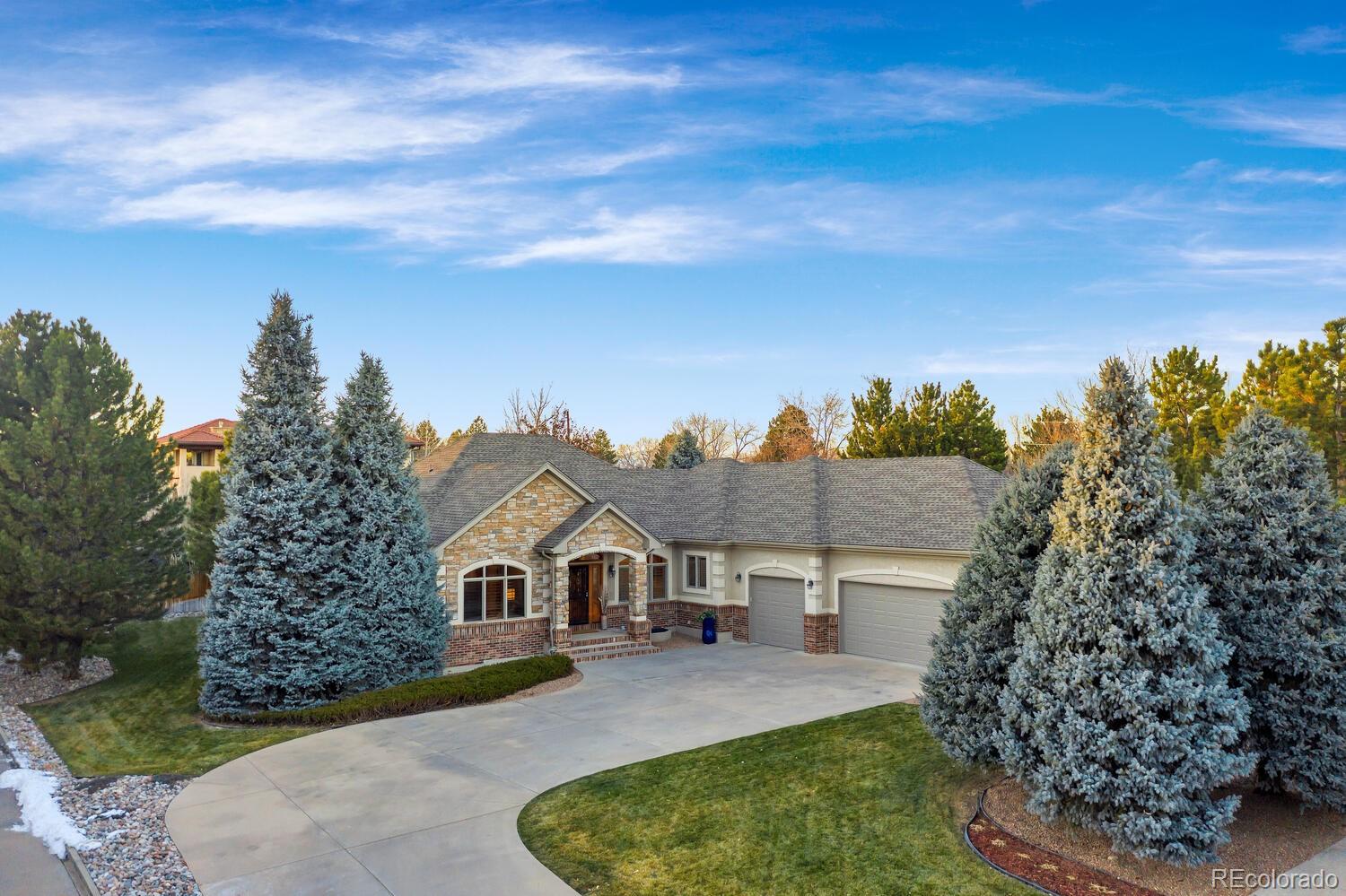 Stunning front exterior with mature trees