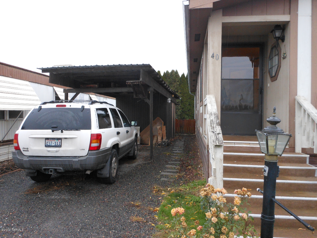 110 Sage Trail Road, Unit 40 Yakima, WA 98901 - Photo 8 of 10 a view of a house with a backyard and balcony