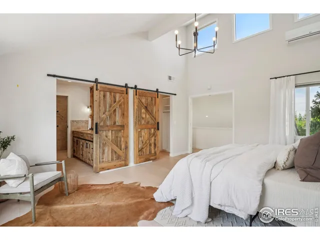 a large white bed in a white room