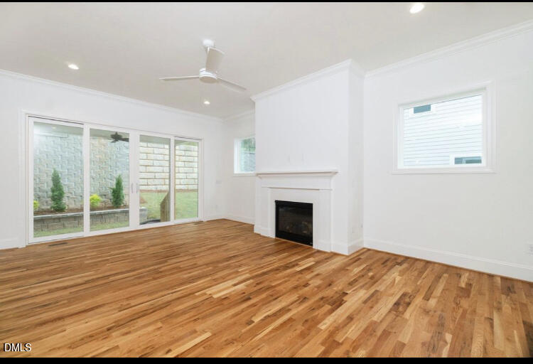 1407 Onslow Road Raleigh, NC 27606 - Photo 2 of 7 a view of empty room with wooden floor and fan