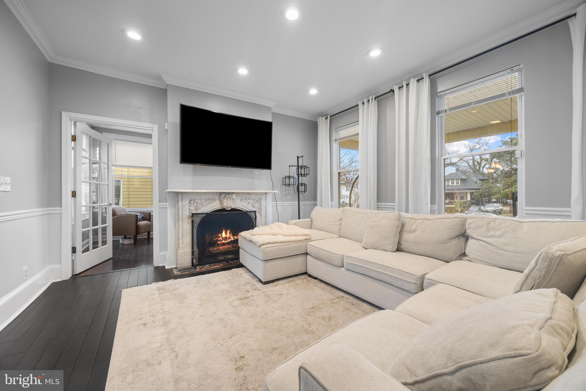 3814 Chatham Road Baltimore, MD 21215 - Photo 1 of 45 a living room with furniture fireplace and flat screen tv