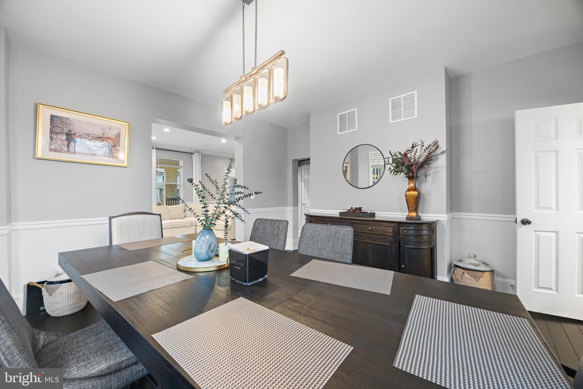 3814 Chatham Road Baltimore, MD 21215 - Photo 11 of 45 a view of a dining room with furniture and wooden floor