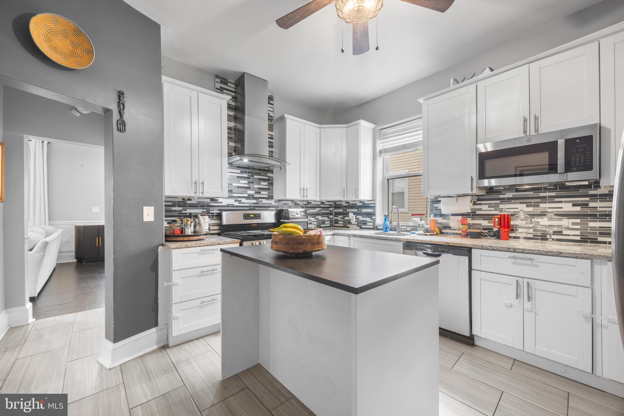 3814 Chatham Road Baltimore, MD 21215 - Photo 12 of 45 a kitchen with cabinets a sink and appliances