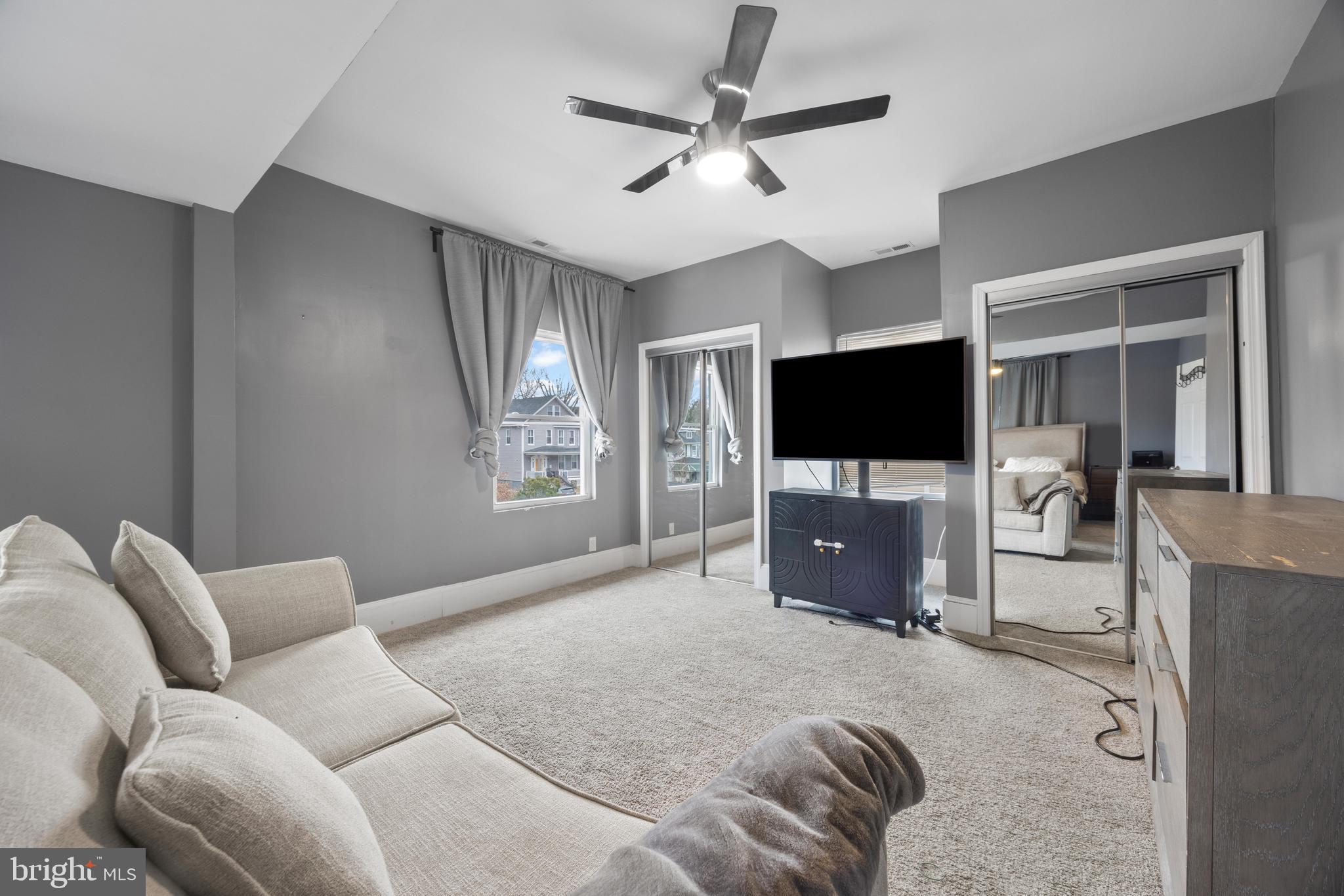 3814 Chatham Road Baltimore, MD 21215 - Photo 18 of 45 a bedroom with furniture and a flat screen tv