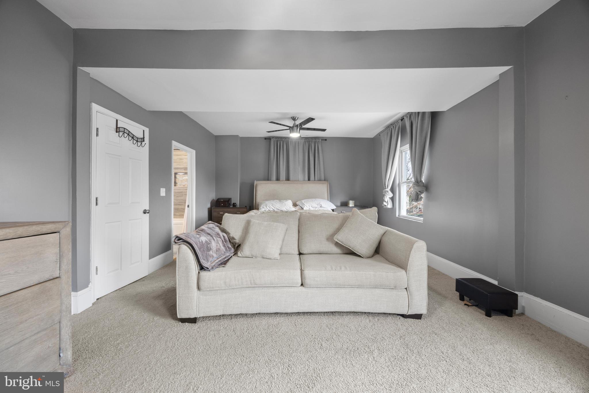 3814 Chatham Road Baltimore, MD 21215 - Photo 20 of 45 a living room with furniture and a chandelier