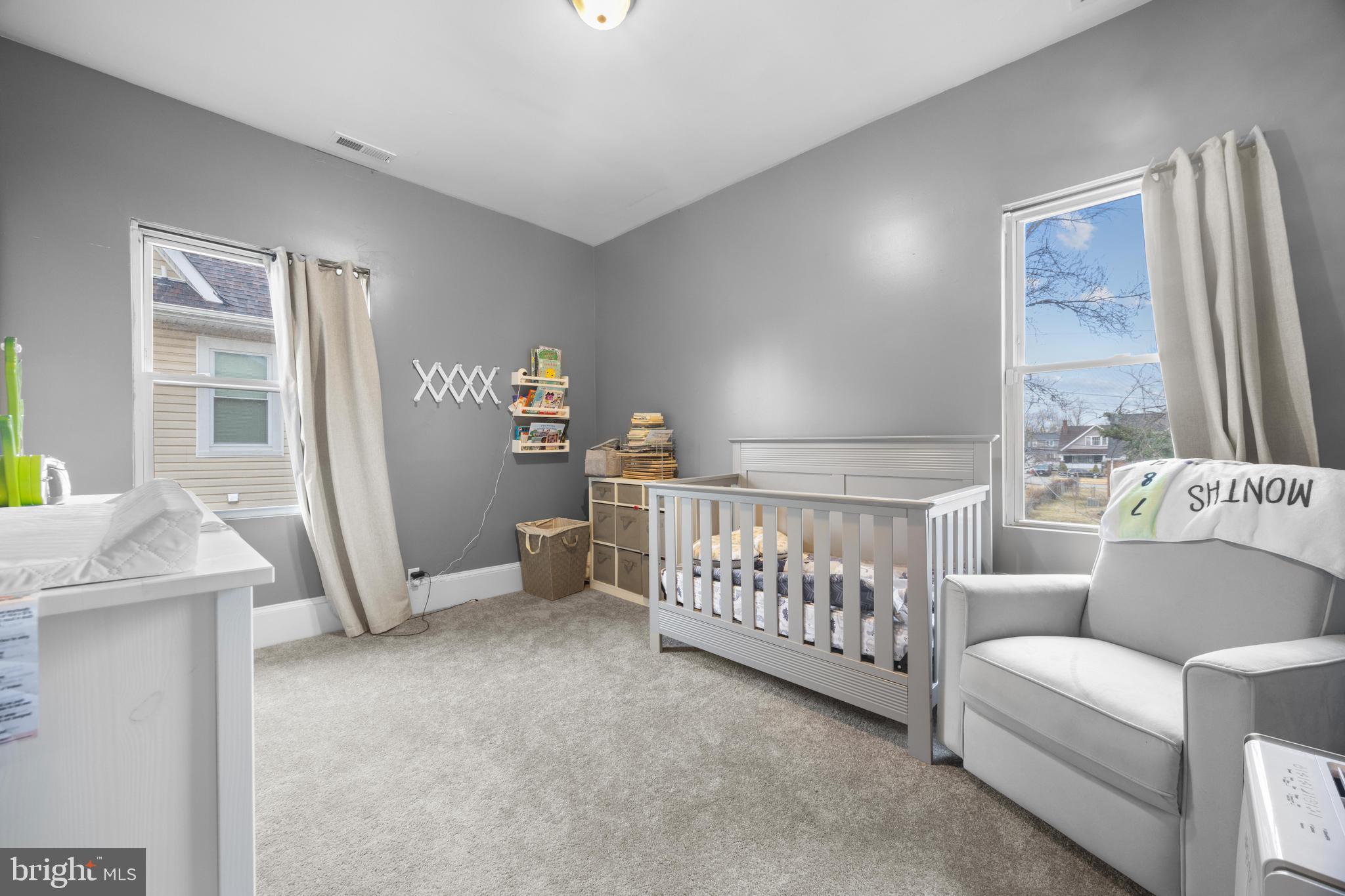 3814 Chatham Road Baltimore, MD 21215 - Photo 23 of 45 a bedroom with furniture and a large window