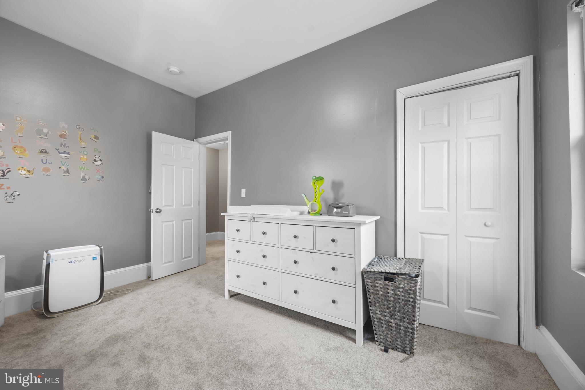 3814 Chatham Road Baltimore, MD 21215 - Photo 24 of 45 a room with a dresser and a lamp