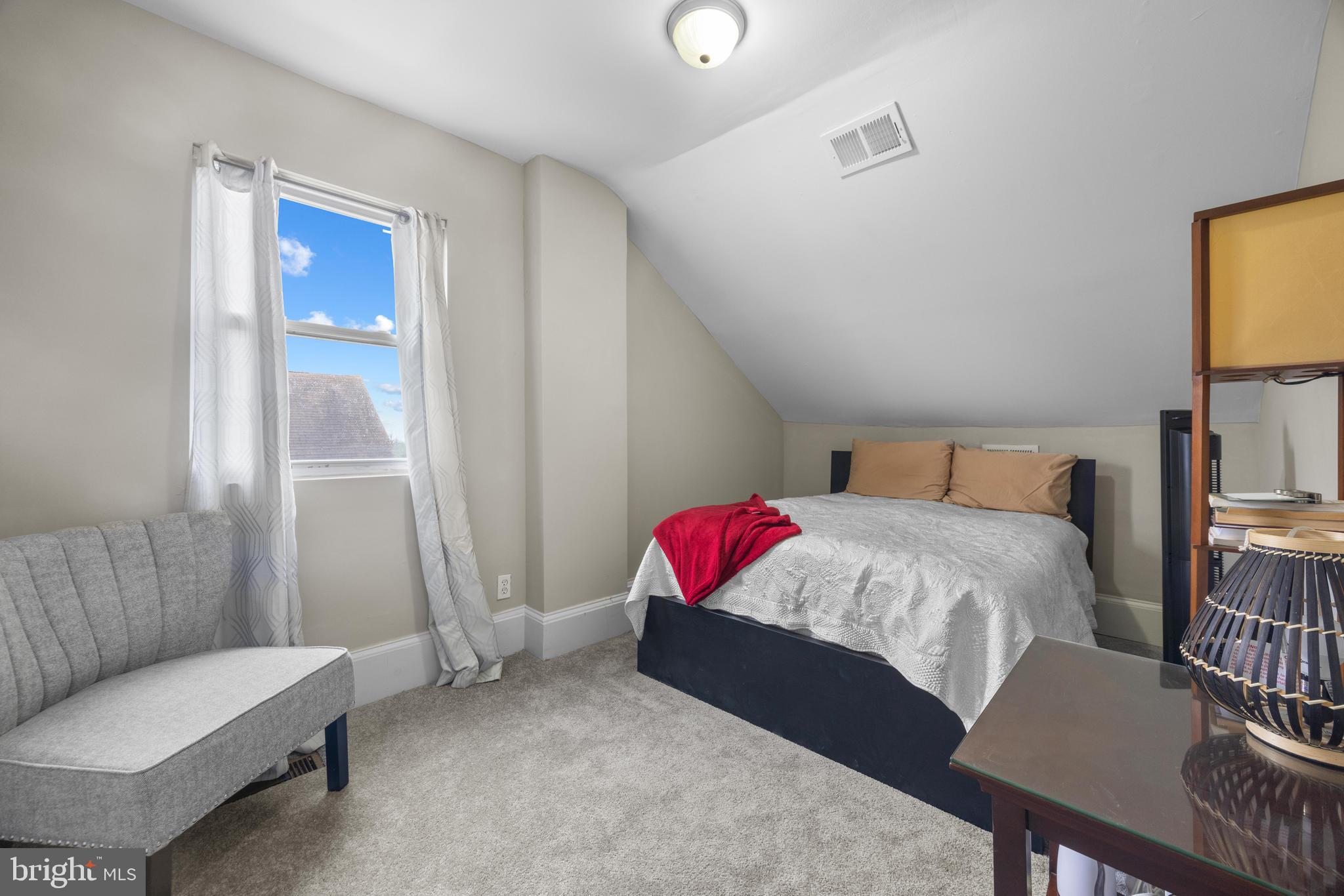 3814 Chatham Road Baltimore, MD 21215 - Photo 27 of 45 a bedroom with a bed and a table