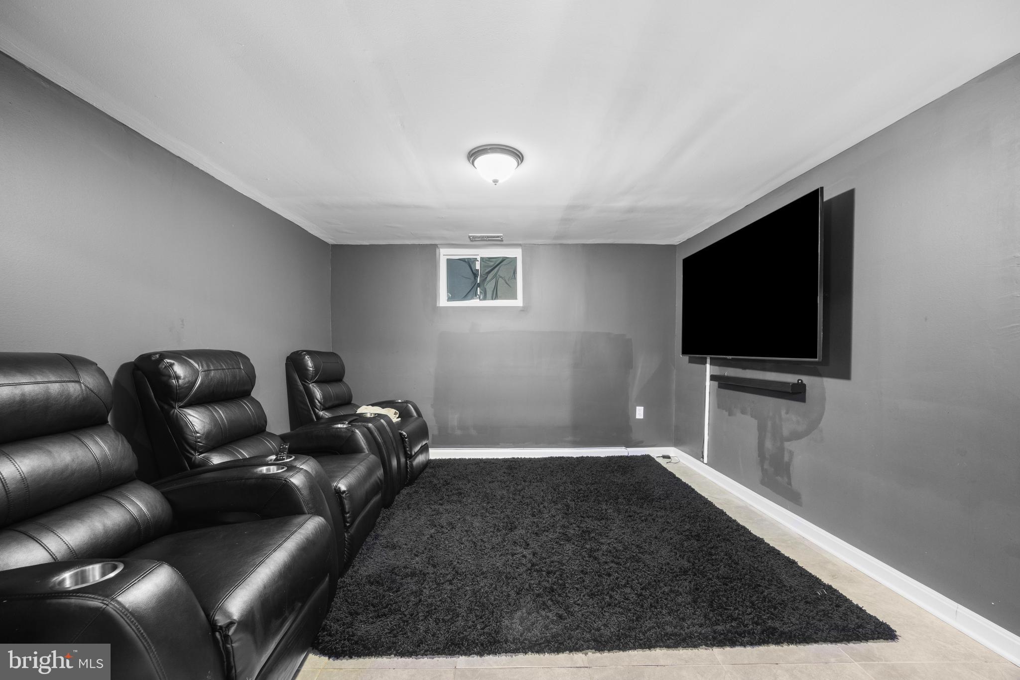 3814 Chatham Road Baltimore, MD 21215 - Photo 33 of 45 a living room with furniture and a flat screen tv
