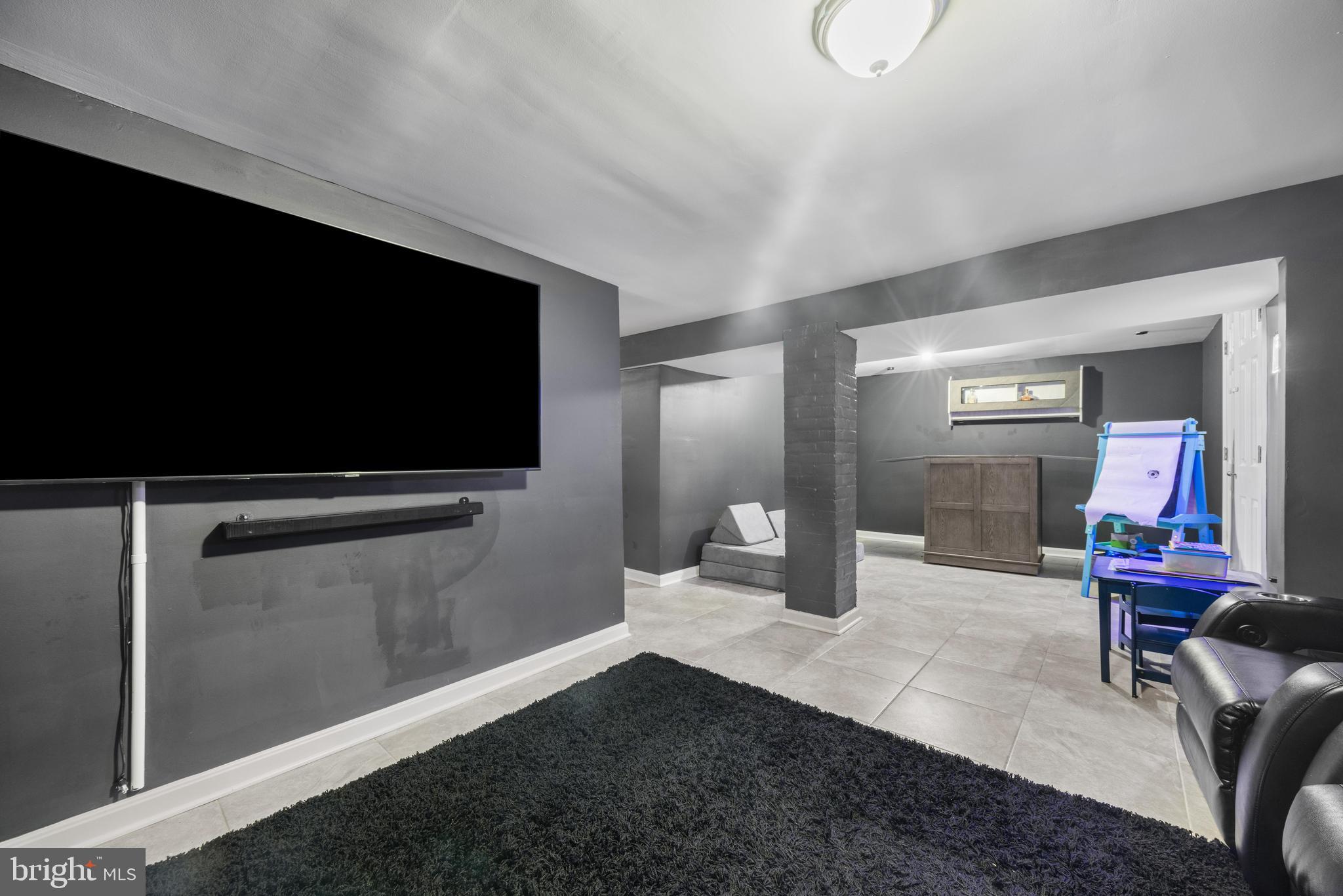 3814 Chatham Road Baltimore, MD 21215 - Photo 34 of 45 a living room with furniture and a flat screen tv