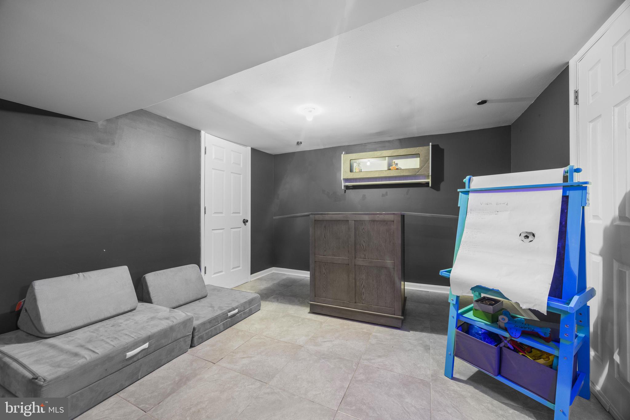 3814 Chatham Road Baltimore, MD 21215 - Photo 35 of 45 a living room with furniture and a baby crib