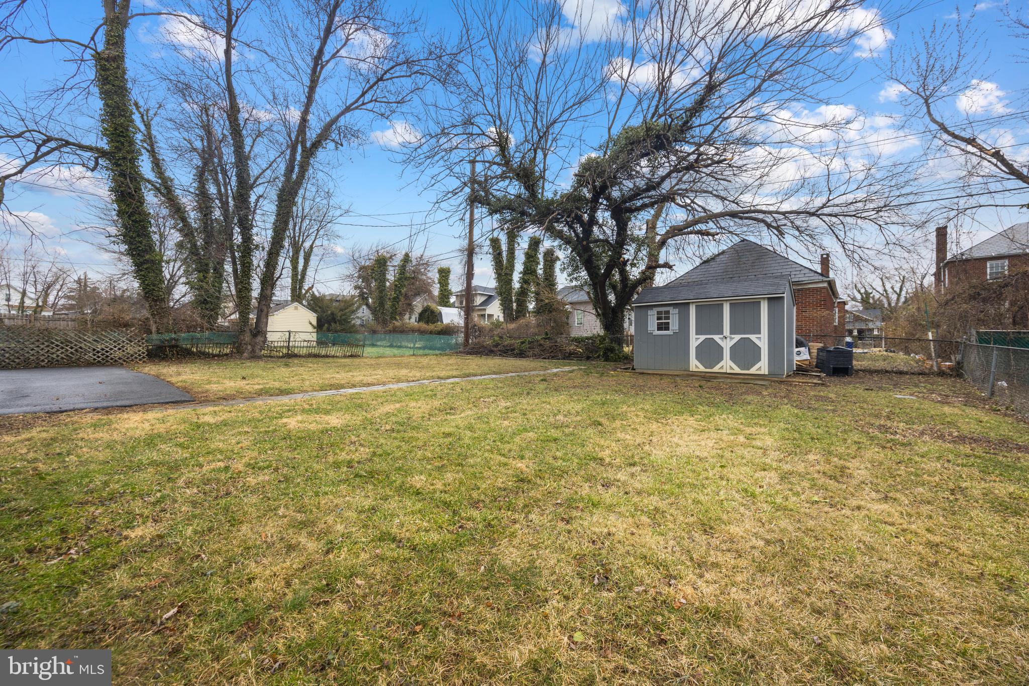 3814 Chatham Road Baltimore, MD 21215 - Photo 40 of 45 a view of a yard with a house and large trees