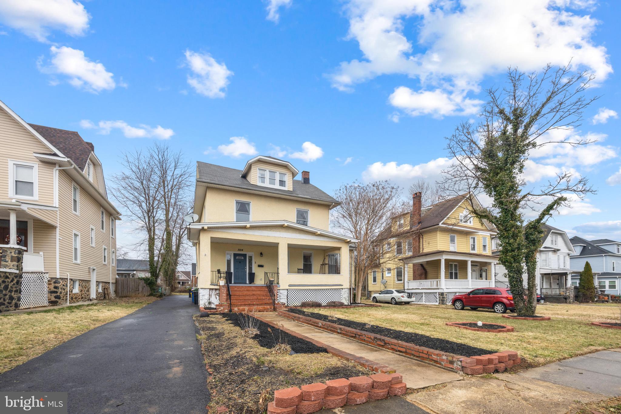3814 Chatham Road Baltimore, MD 21215 - Photo 45 of 45 a front view of a building with lot of cars and trees