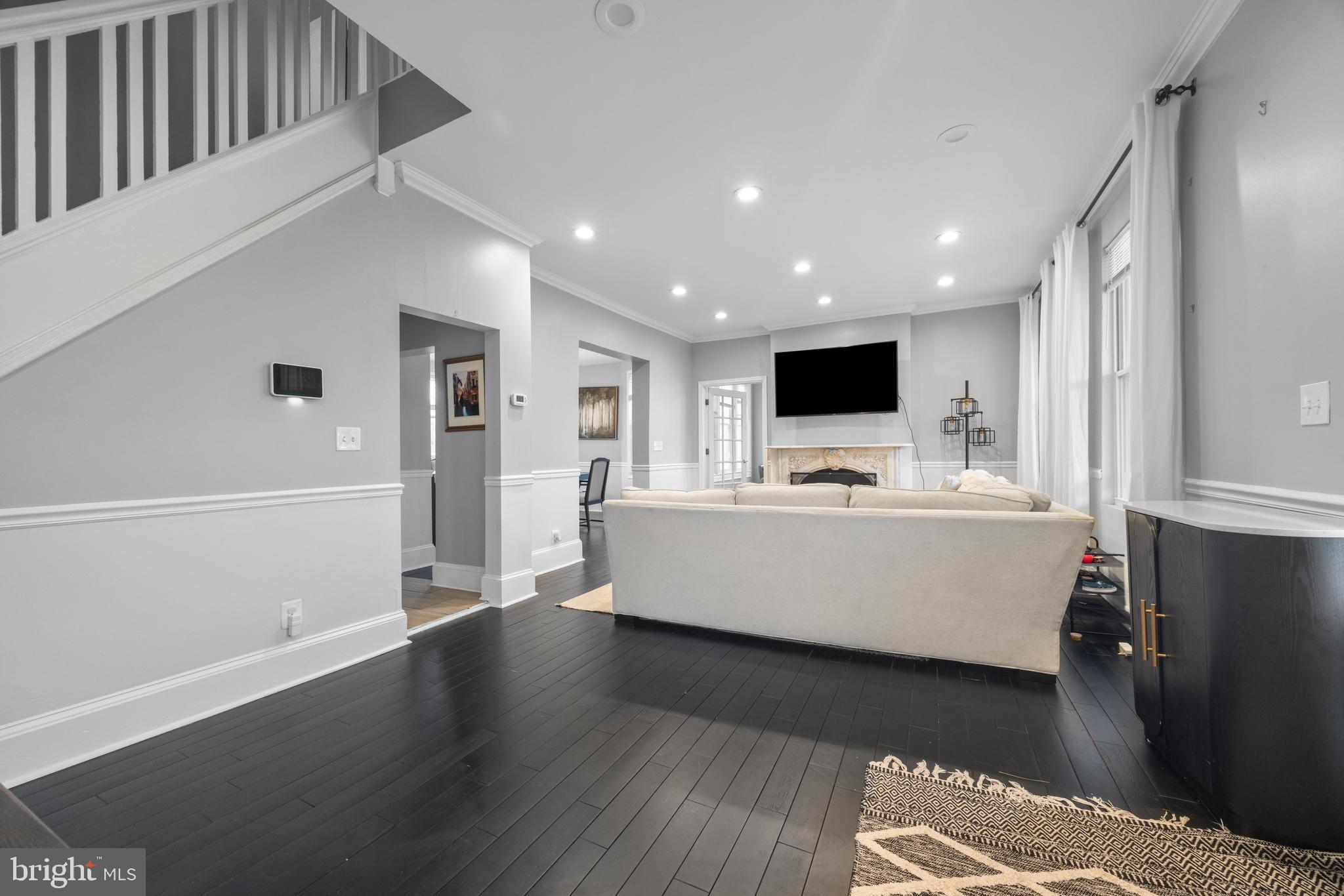 3814 Chatham Road Baltimore, MD 21215 - Photo 6 of 45 a room with wooden floor and white walls