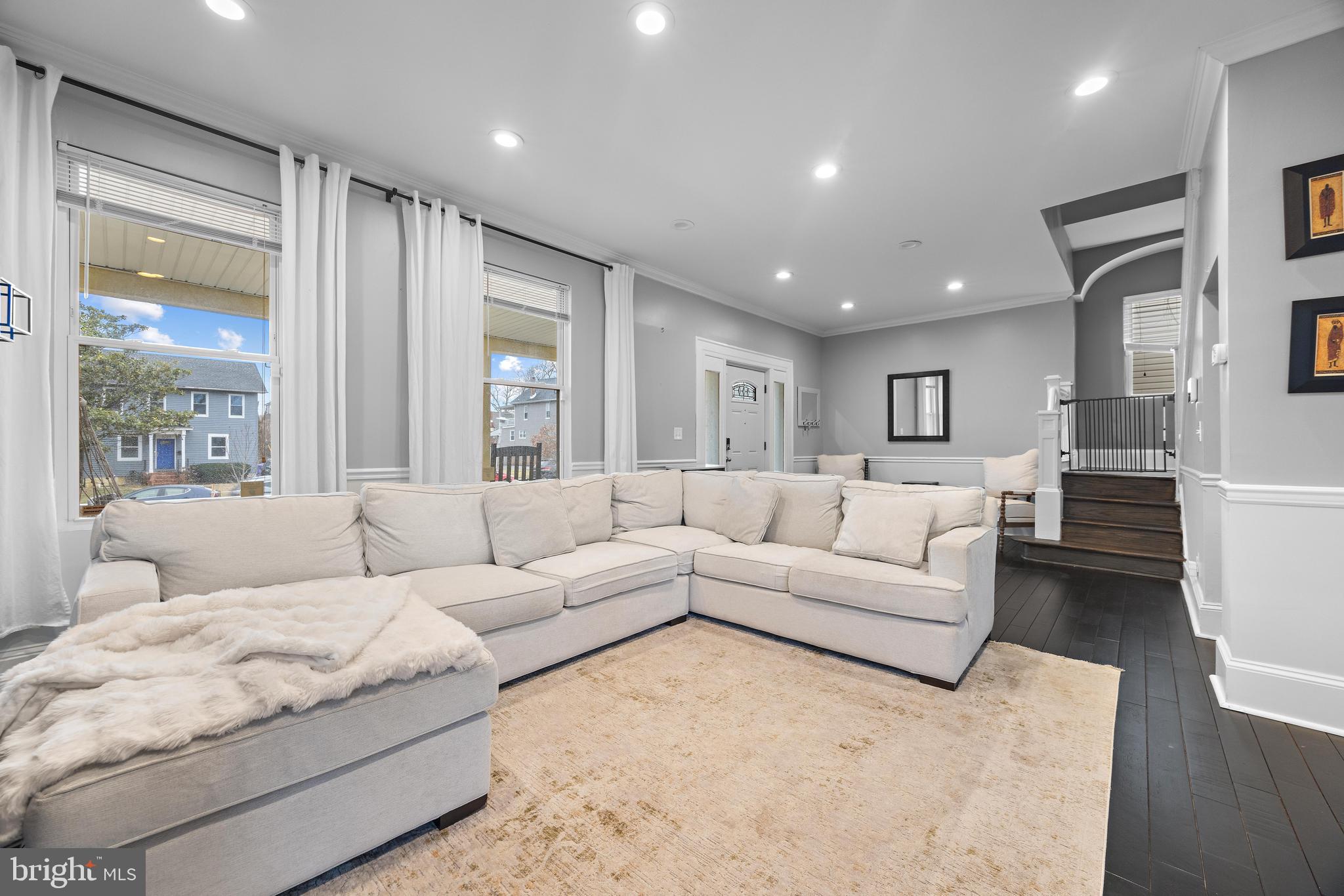3814 Chatham Road Baltimore, MD 21215 - Photo 7 of 45 a living room with furniture and a large window