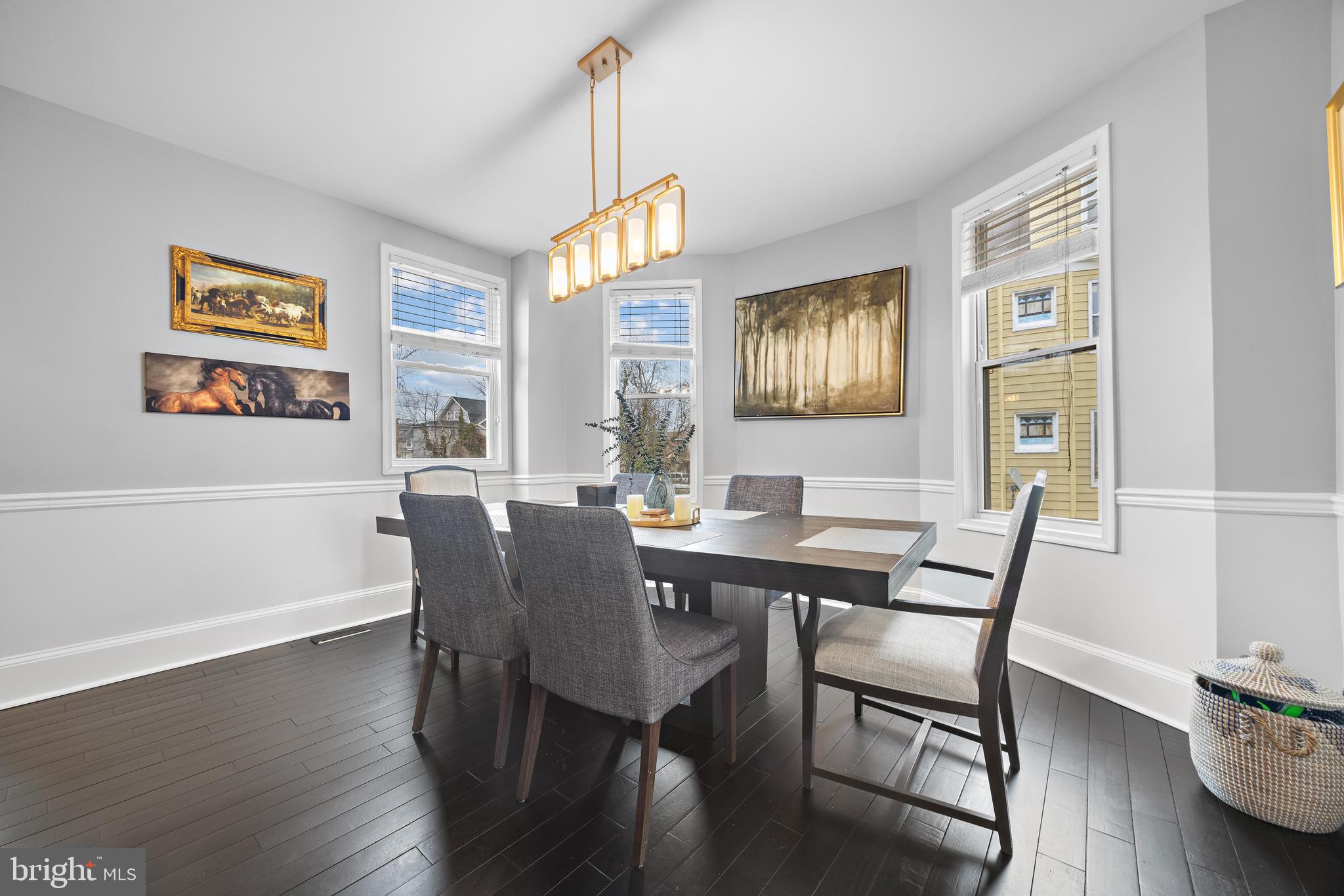 3814 Chatham Road Baltimore, MD 21215 - Photo 10 of 45 a view of a dining room with furniture window and wooden floor