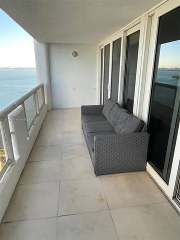 a bathroom with a shower a toilet and a sink