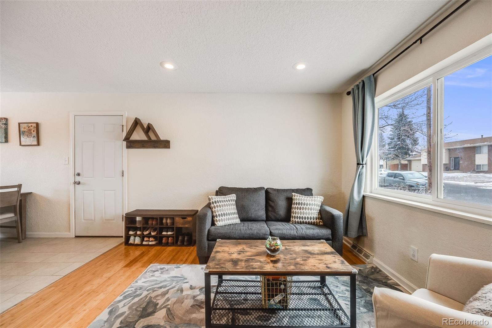 8331 Mason Circle Westminster, CO 80031 - Photo 6 of 30 a outdoor living space with furniture and a window