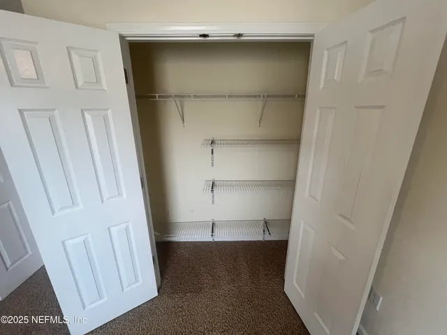 a view of a hallway with windows