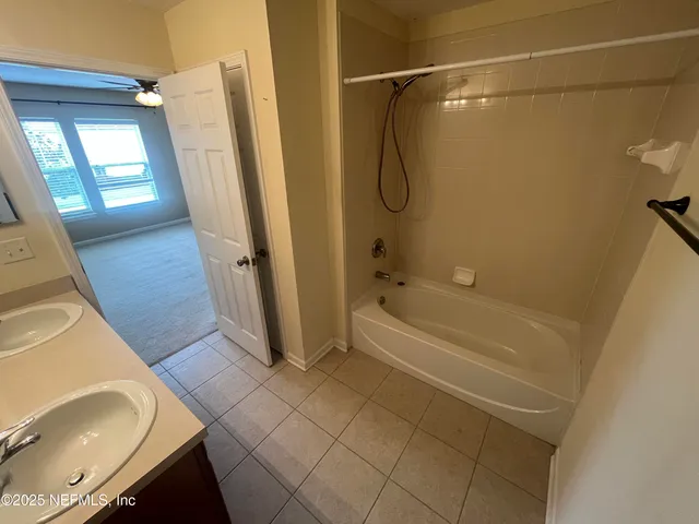 a bathroom with a bath tub and a shower