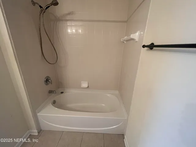 a bathroom with a sink vanity granite and toilet