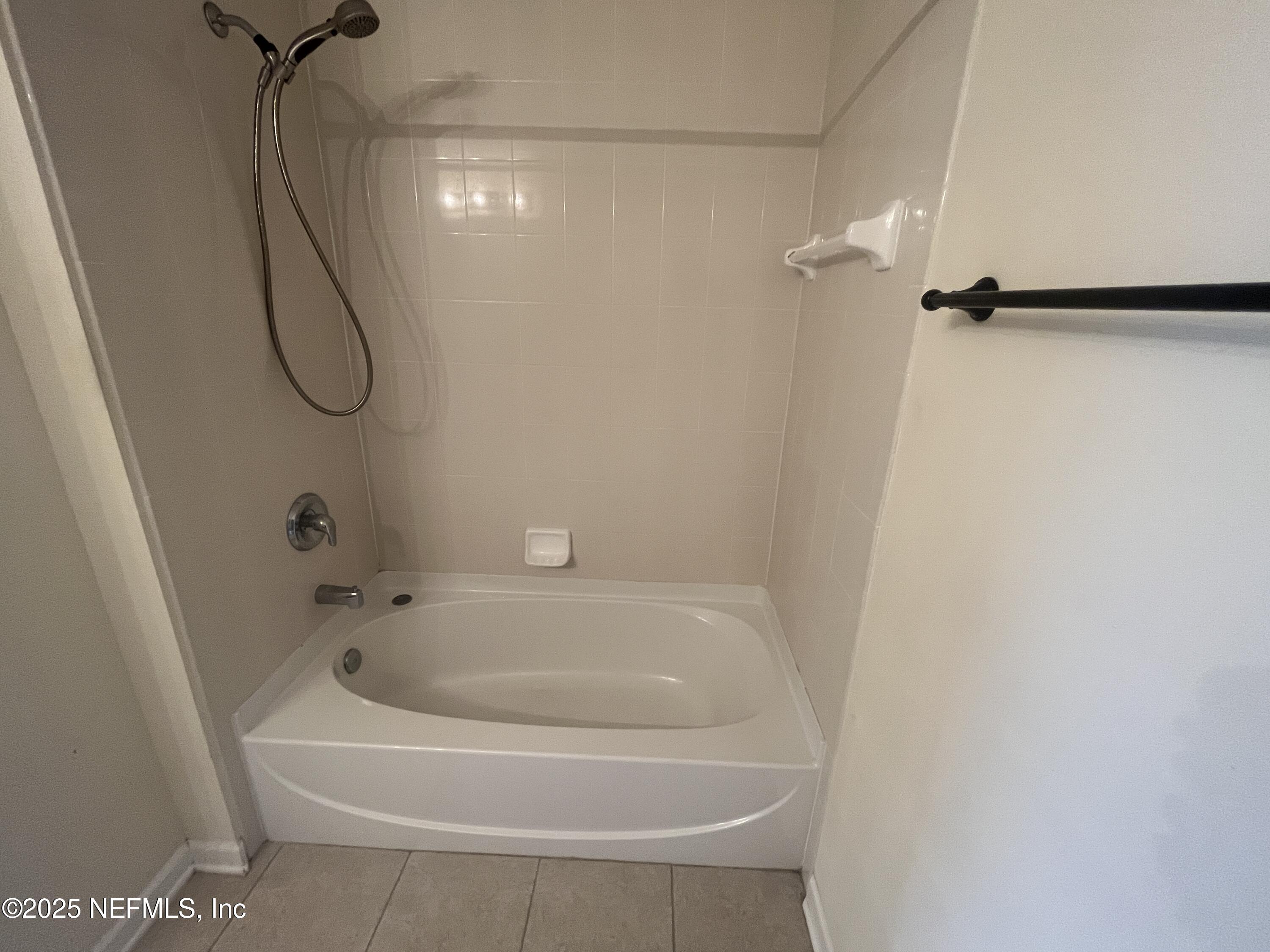 1500 Calming Water Drive, Unit 5201 Fleming Island, FL 32003 - Photo 27 of 39 a bathroom with a bath tub and a shower