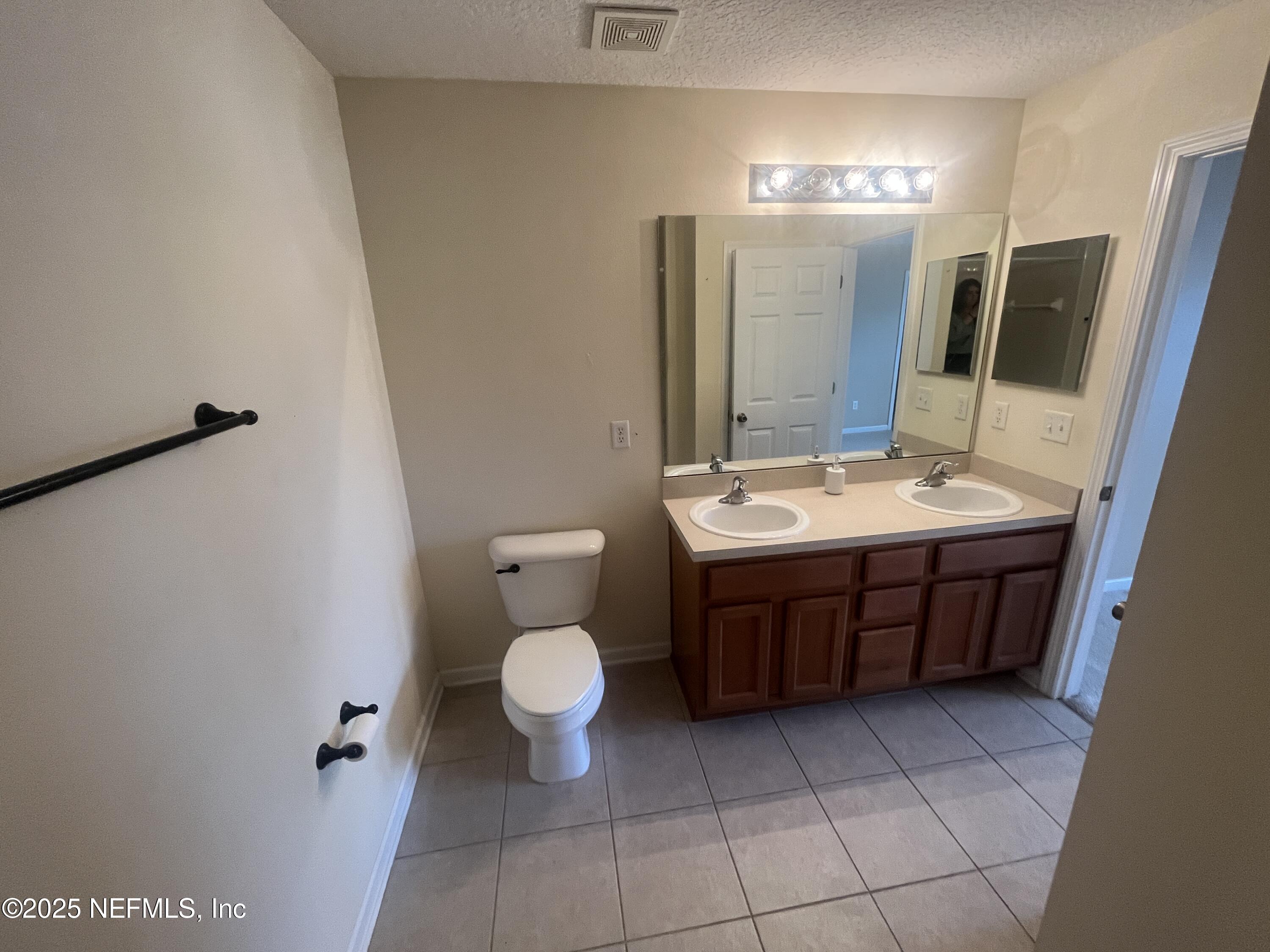 1500 Calming Water Drive, Unit 5201 Fleming Island, FL 32003 - Photo 28 of 39 a bathroom with a sink vanity granite and toilet