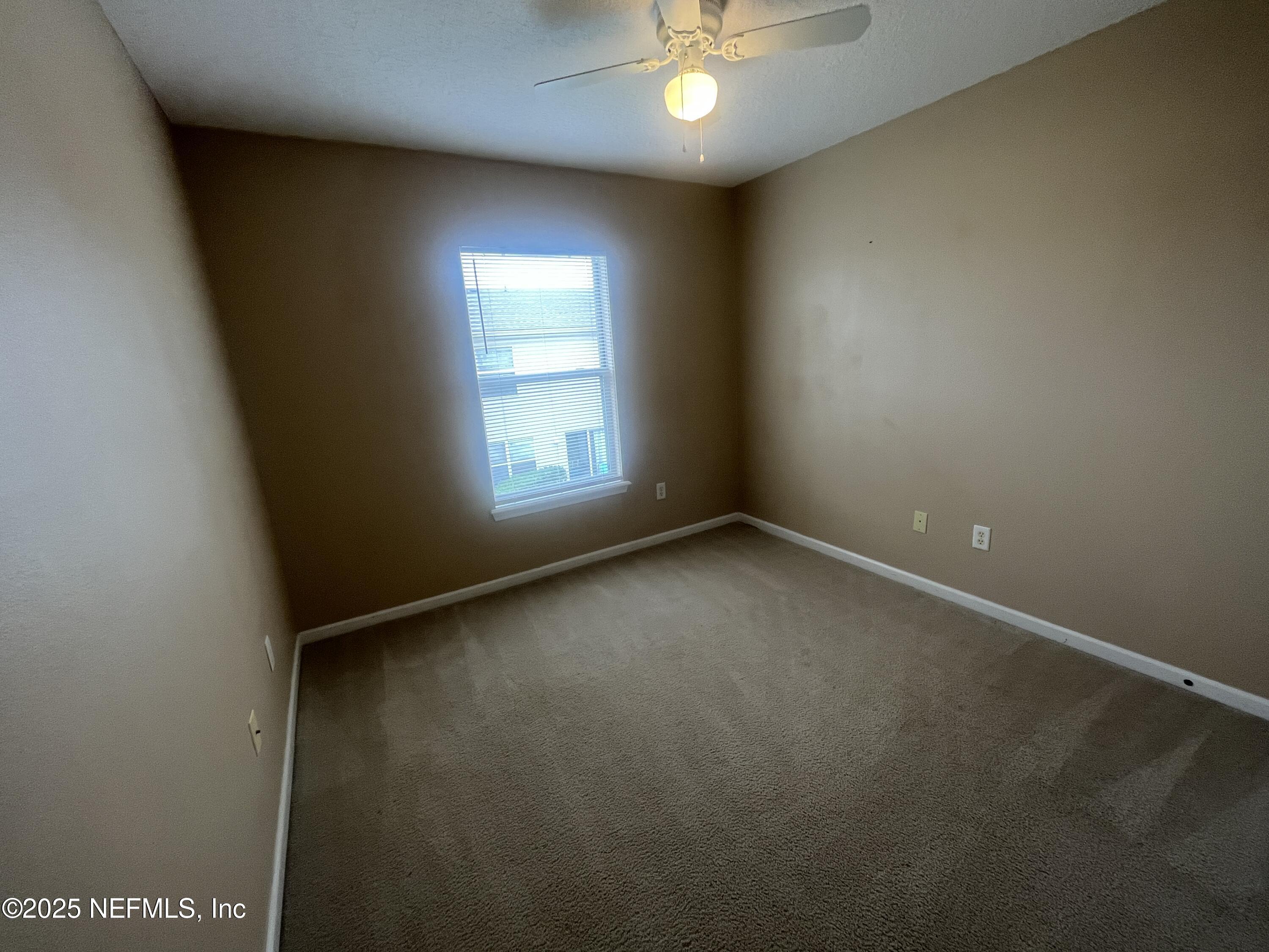 1500 Calming Water Drive, Unit 5201 Fleming Island, FL 32003 - Photo 34 of 39 an empty room with a window