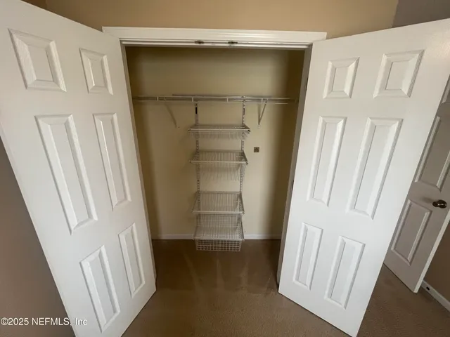 a view of a utility room with washer and dryer