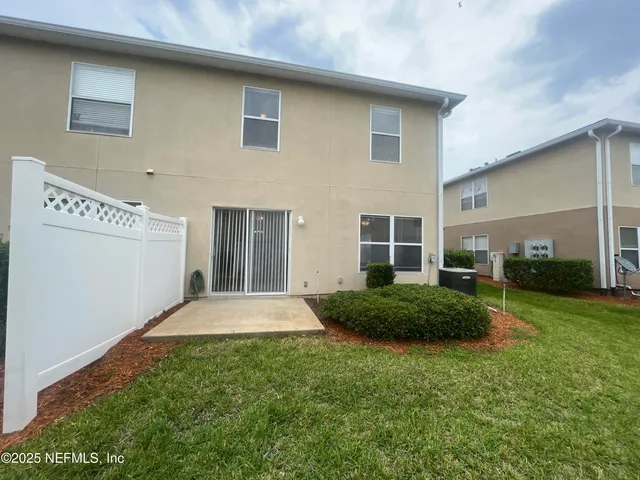 a view of storage and utility room with a refrigerator