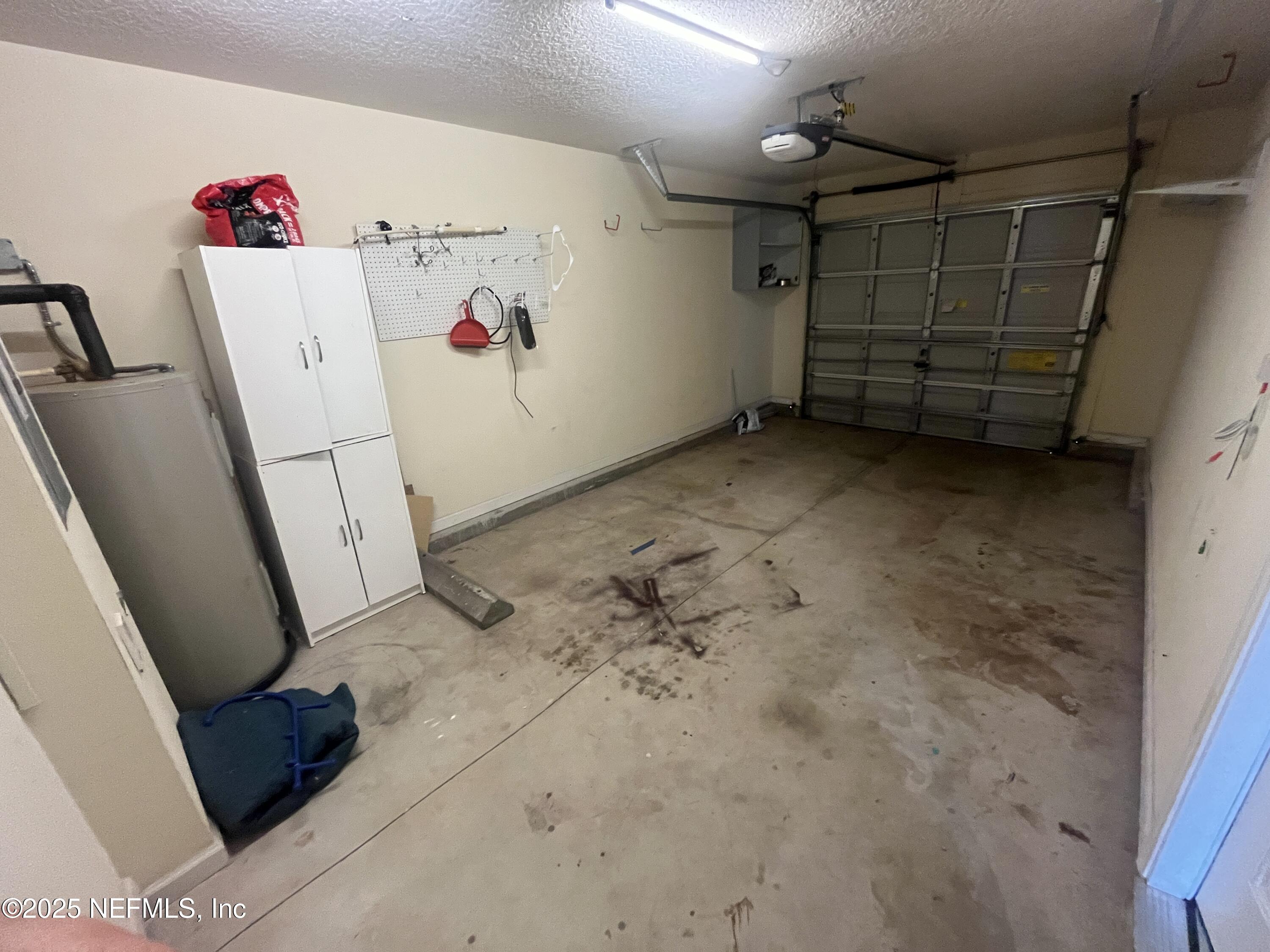 1500 Calming Water Drive, Unit 5201 Fleming Island, FL 32003 - Photo 39 of 39 a view of storage and utility room with a refrigerator