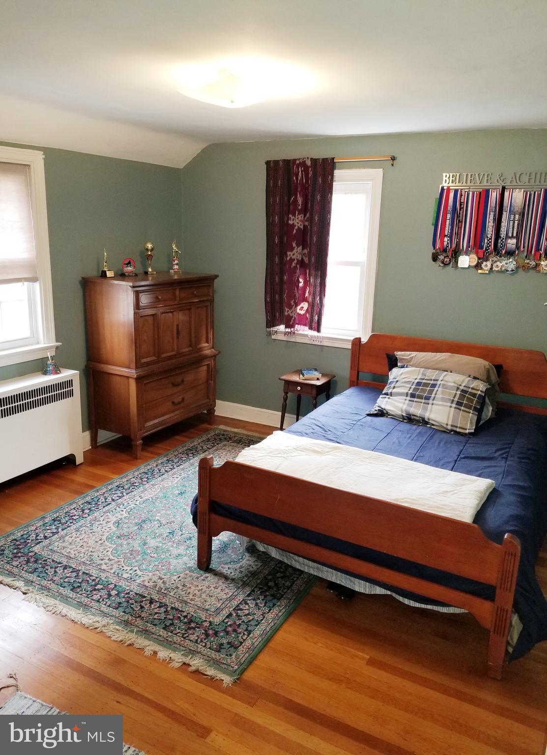 211 Ridley Drive Wallingford, PA 19086 - Photo 12 of 12 a bedroom with a bed and furniture