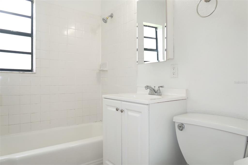 6013 Francis Drive Apollo Beach, FL 33572 - Photo 20 of 20 a bathroom with a sink a toilet and shower