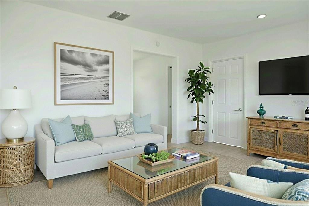 6013 Francis Drive Apollo Beach, FL 33572 - Photo 2 of 20 a living room with furniture and a flat screen tv