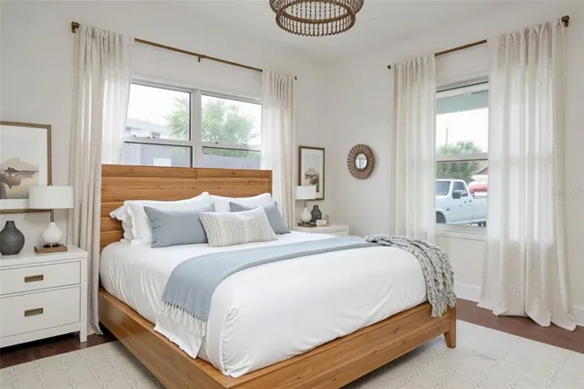 a bedroom with a bed and window