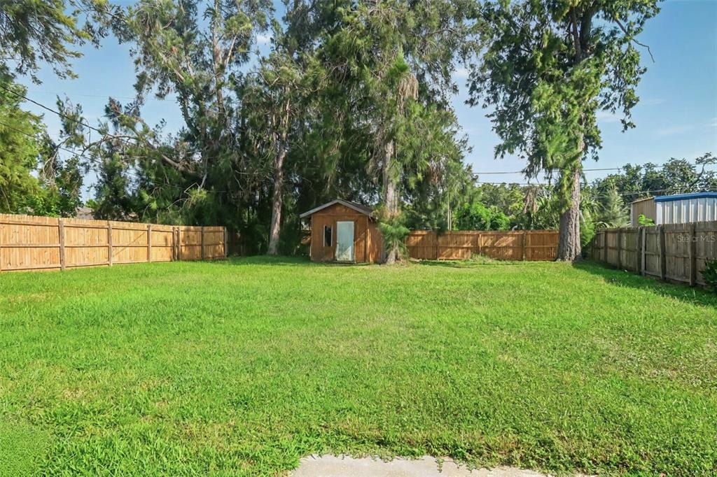 6013 Francis Drive Apollo Beach, FL 33572 - Photo 9 of 20 a view of a backyard with a garden and entertaining space