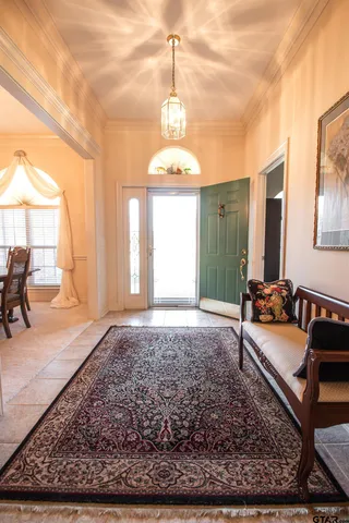 a view of a livingroom with furniture window and wooden floor