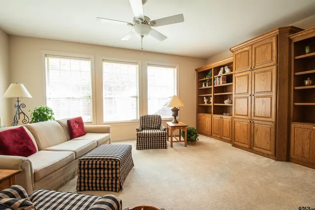 a living room with furniture and a window