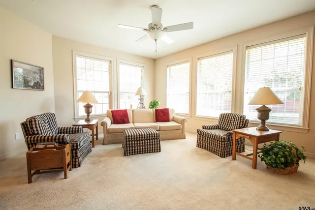 a living room with furniture and a large window