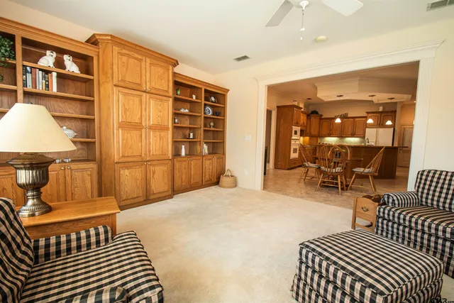 a bedroom with furniture and a window