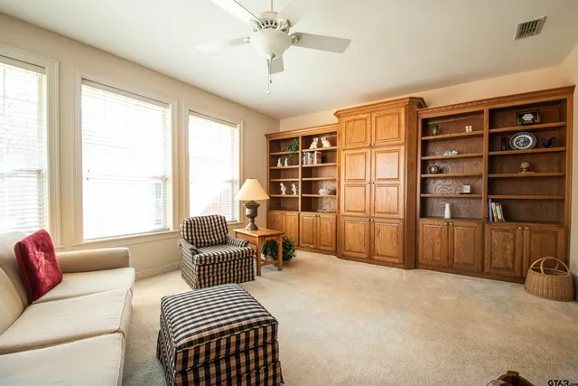 a bedroom with a bed furniture and a window