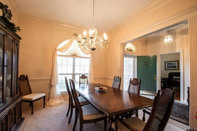 a view of a dining room with furniture and window