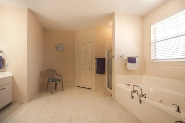 a bathroom with a bathtub and a sink