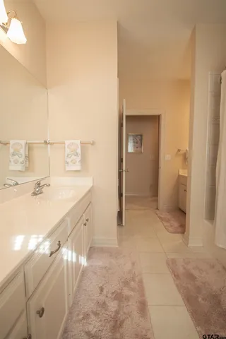 a bathroom with a sink and mirror