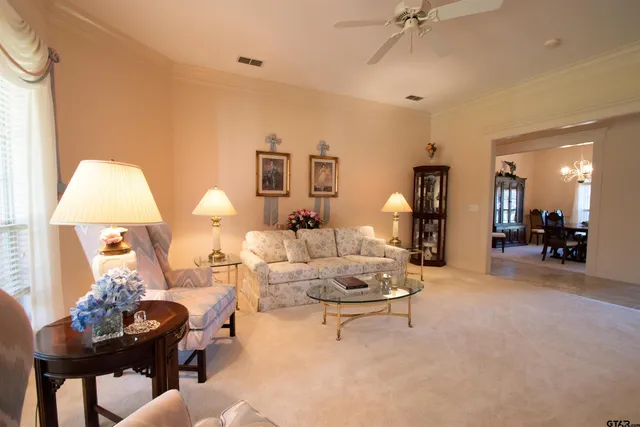 a living room with furniture and a table