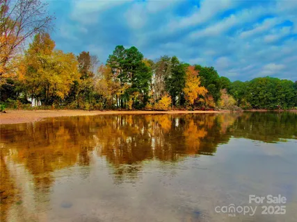 an aerial view of a house with a yard and garden