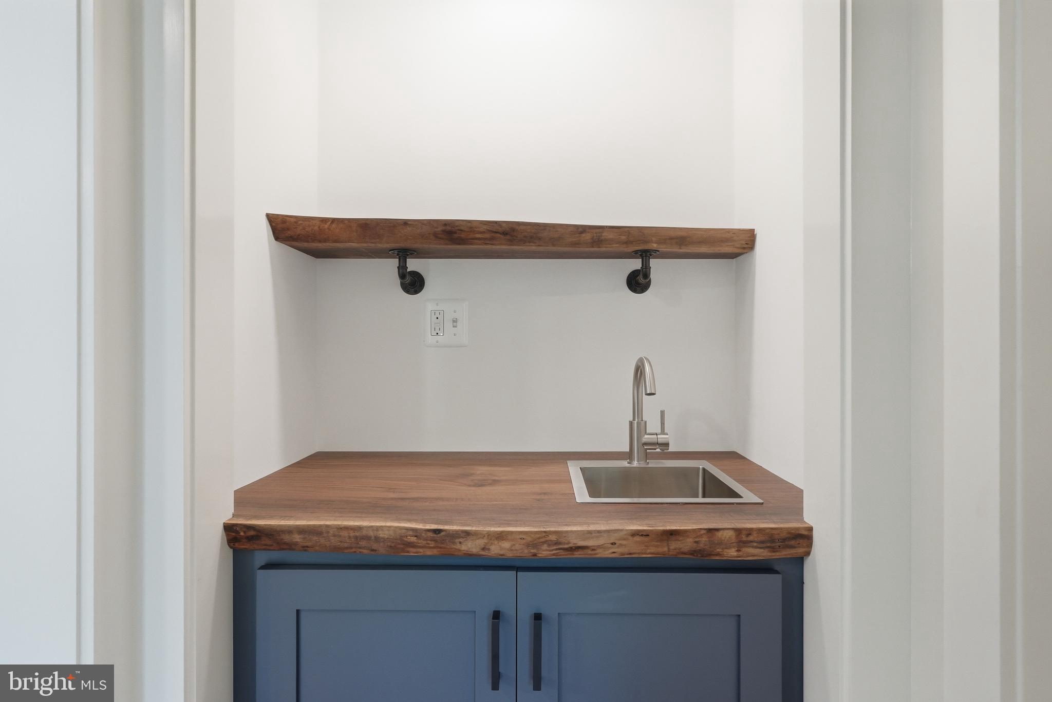 1548 James City Road Reva, VA 22735 - Photo 20 of 48 a bathroom with a granite countertop sink and white cabinets